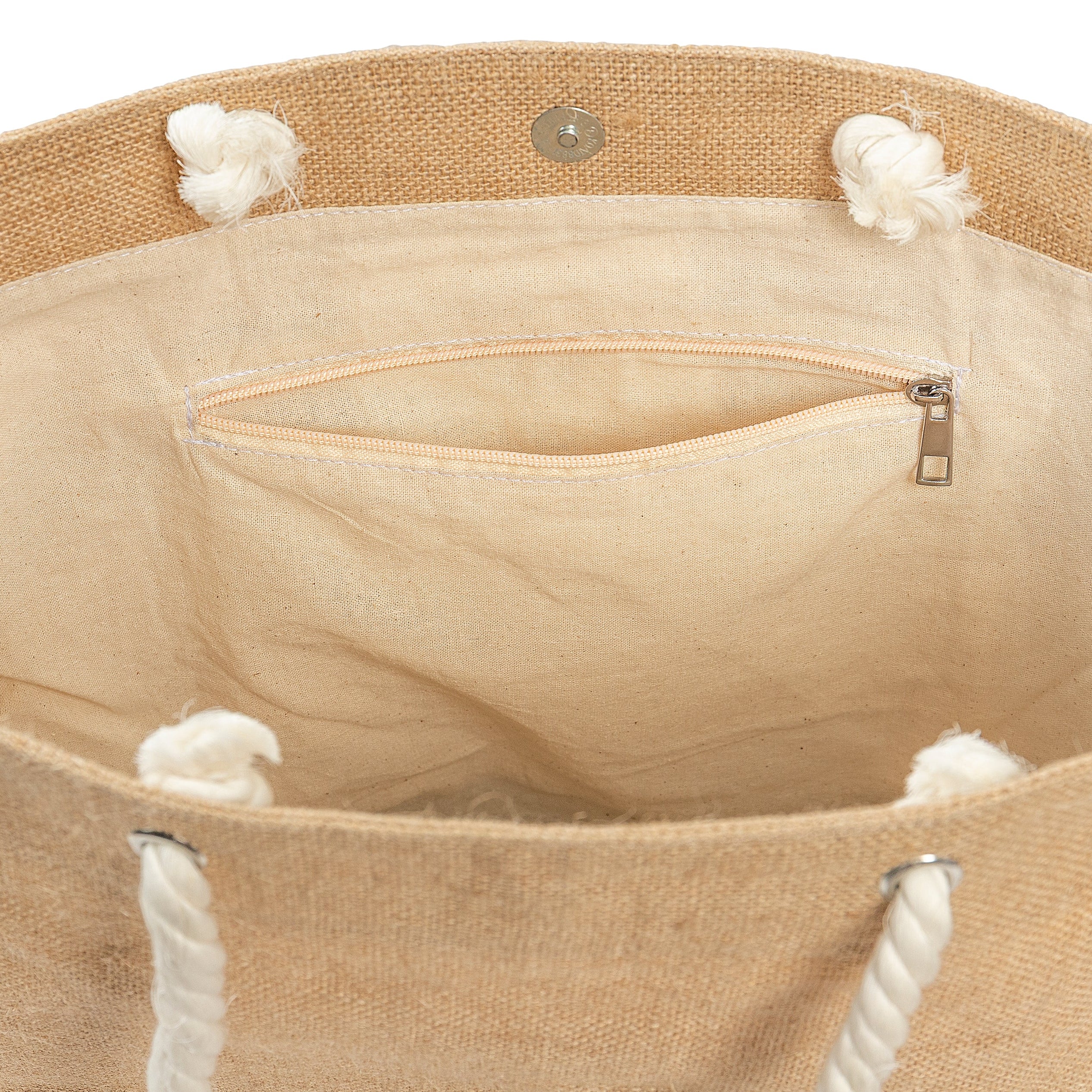 Close-up of a beige tote bag with white rope handles and trim on a white background