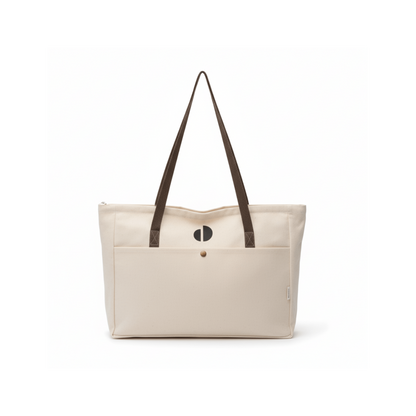 Beige tote bag with brown straps on a white background